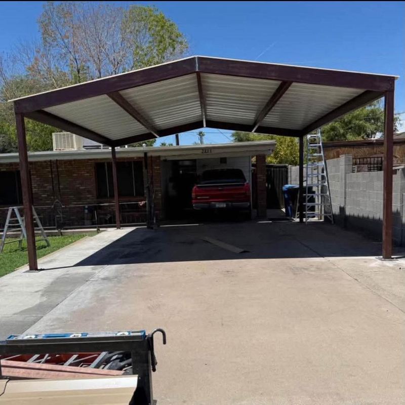 Steel frame carport over driveway